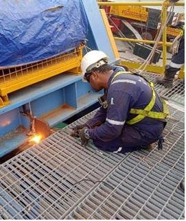 Technician carrying out hot work during a maintenance job